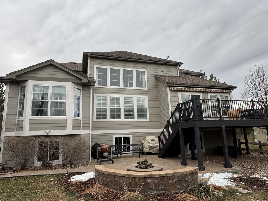 Two-story Castle Rock, CO home with new white fiberglass replacement windows and walkout basement
